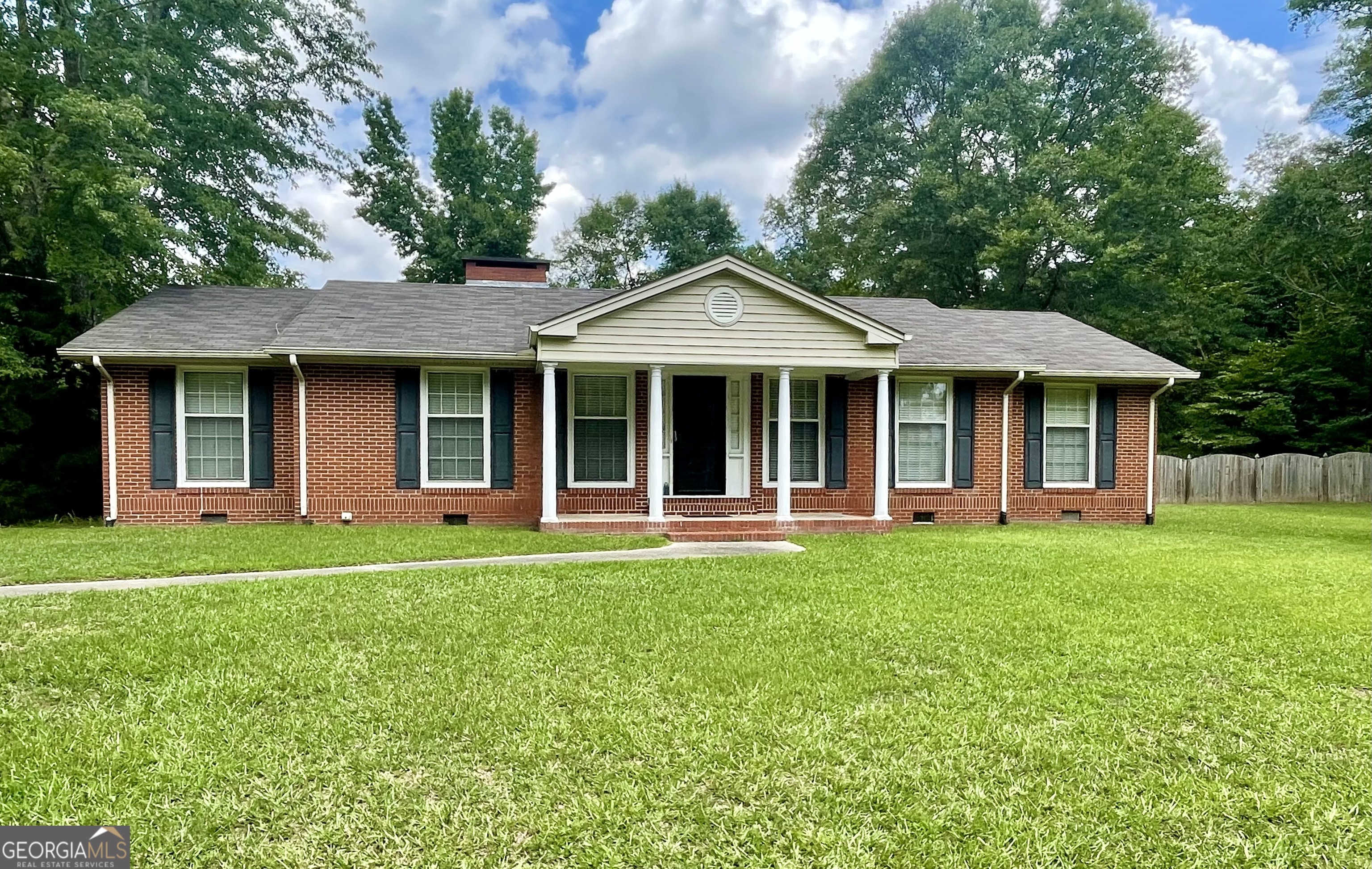 205 Old Stone Road Villa Rica, GA 30180 - Photo 1 of 1 a front view of a house with a yard porch and outdoor seating