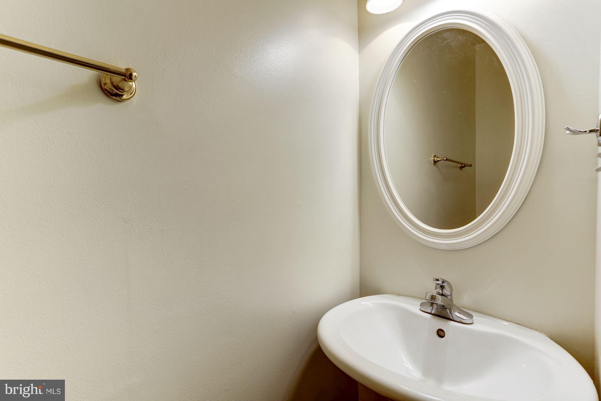 727 13th Street Northeast Washington, DC 20002 - Photo 15 of 27 a bathroom with a sink and a mirror