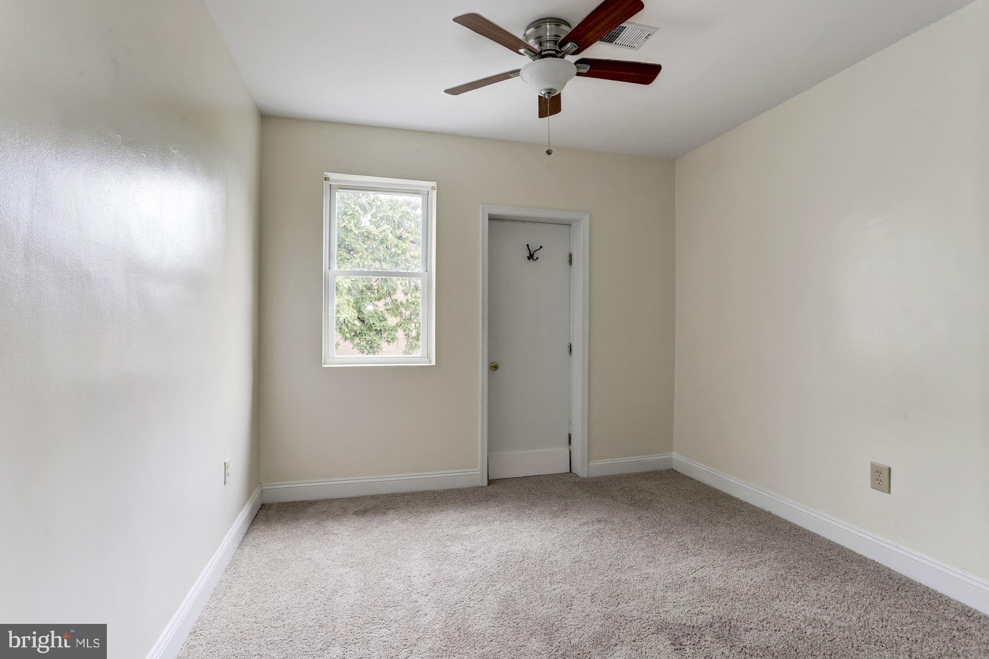 727 13th Street Northeast Washington, DC 20002 - Photo 19 of 27 an empty room with a window and a fan