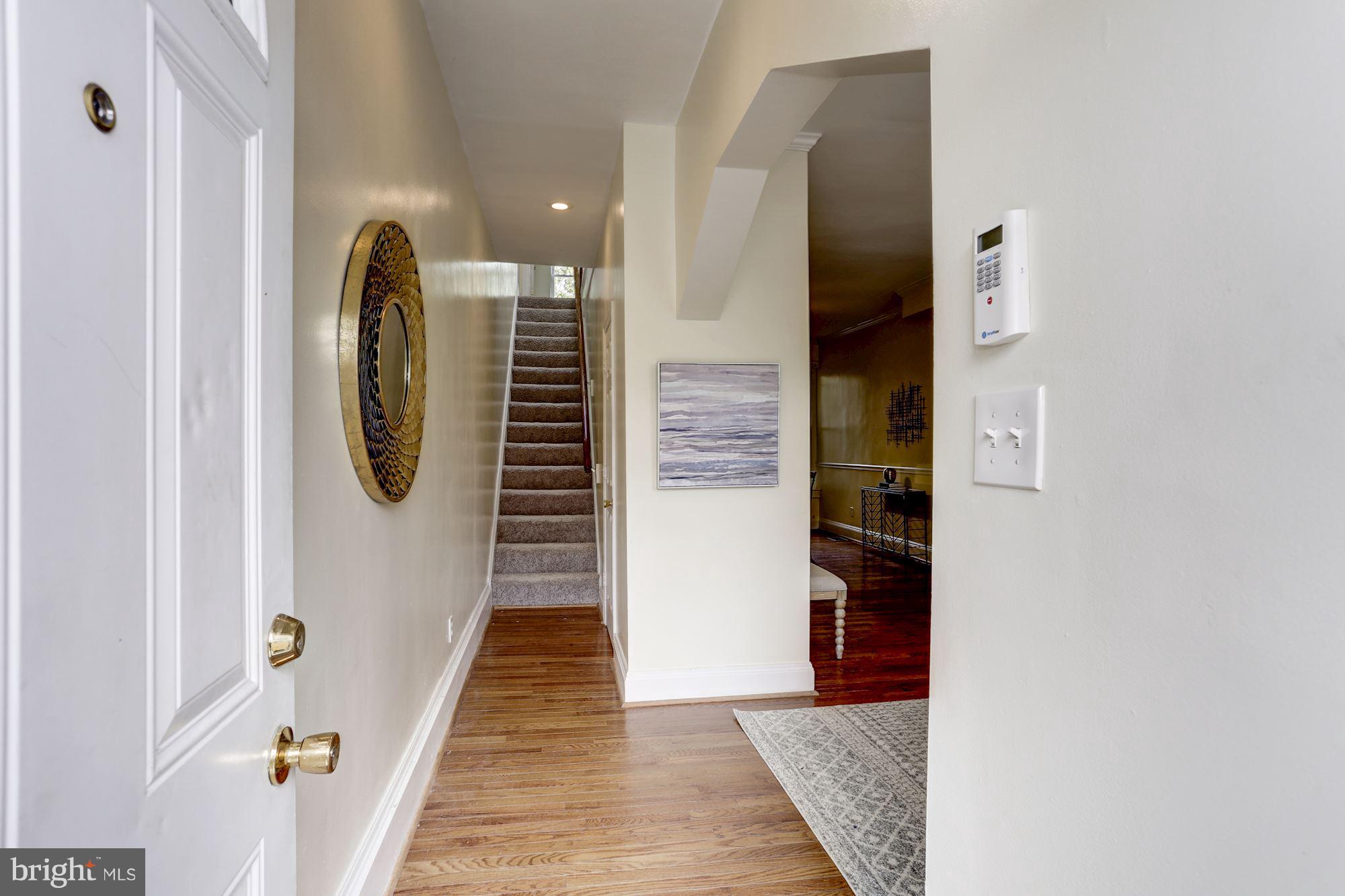 727 13th Street Northeast Washington, DC 20002 - Photo 3 of 27 a view of a hallway with wooden floor and entryway