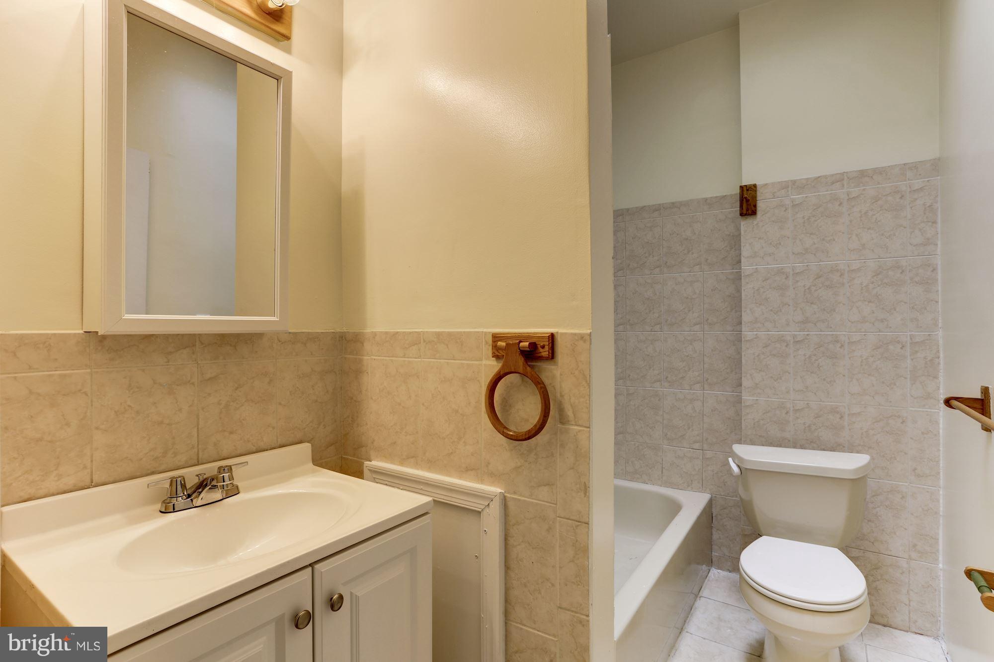 727 13th Street Northeast Washington, DC 20002 - Photo 21 of 27 a bathroom with a sink toilet and shower