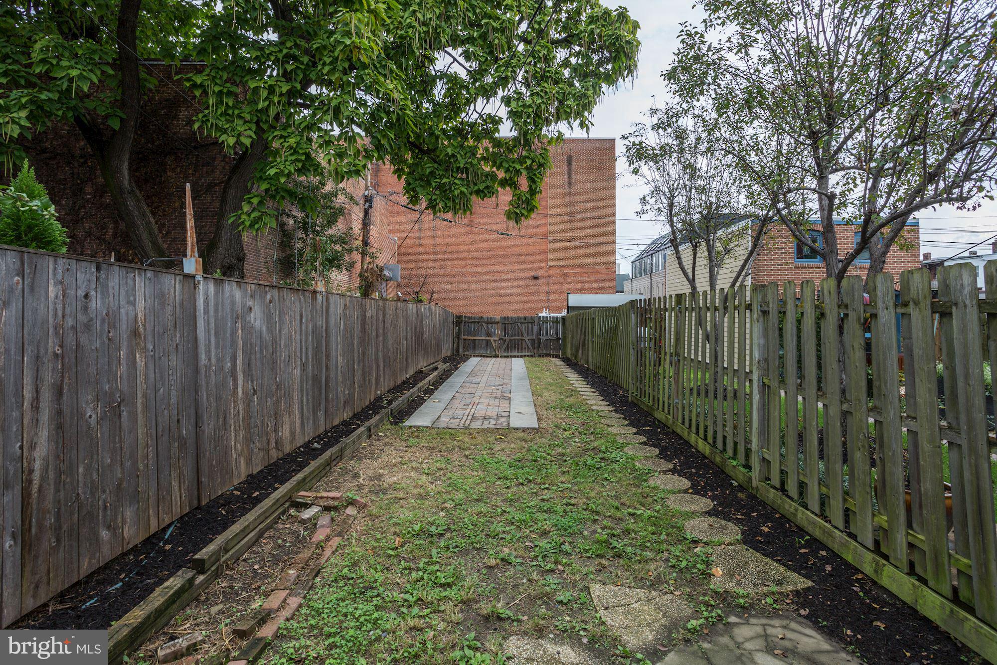 727 13th Street Northeast Washington, DC 20002 - Photo 24 of 27 a view of a backyard with wooden fence