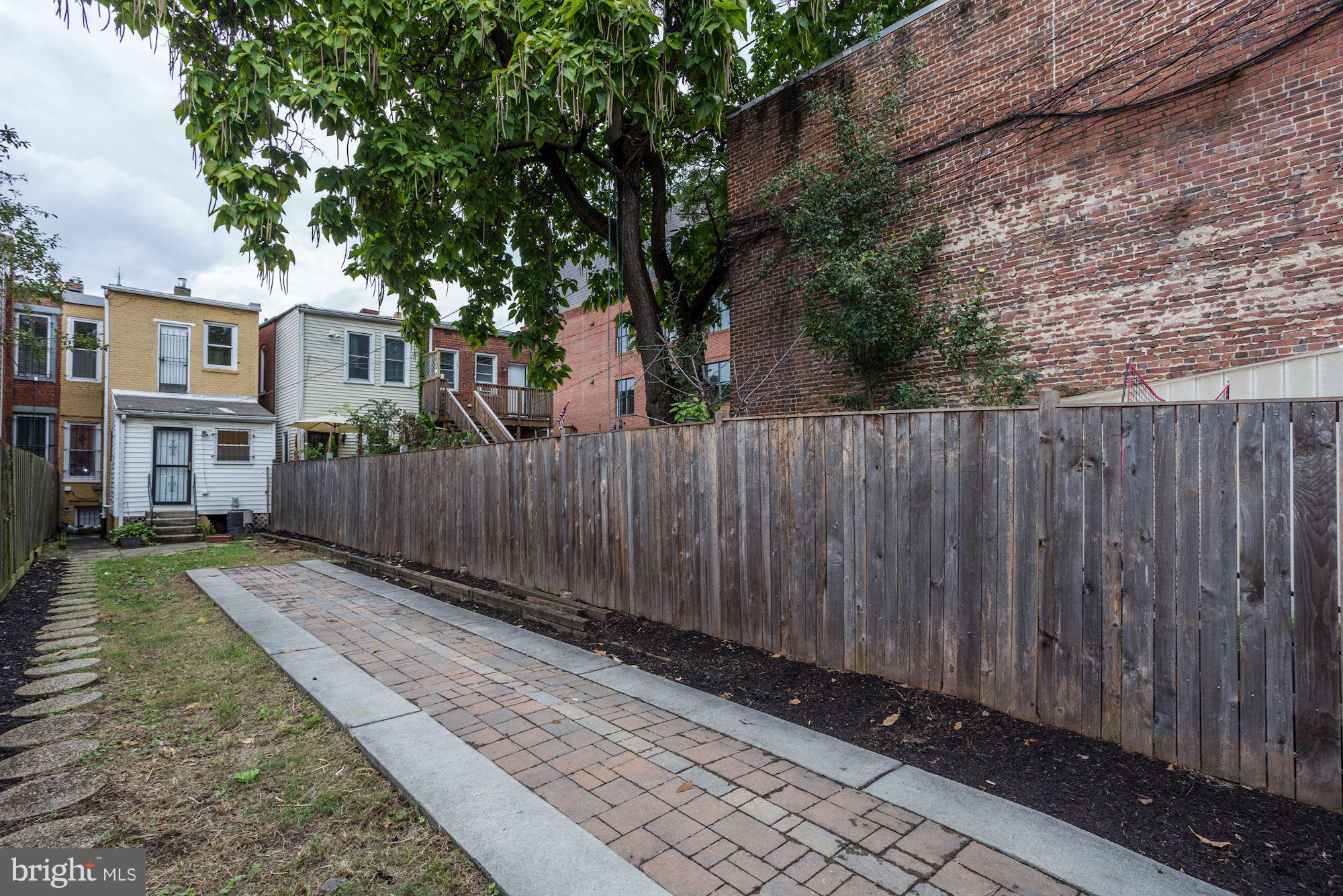 727 13th Street Northeast Washington, DC 20002 - Photo 25 of 27 a view of a backyard with wooden fence