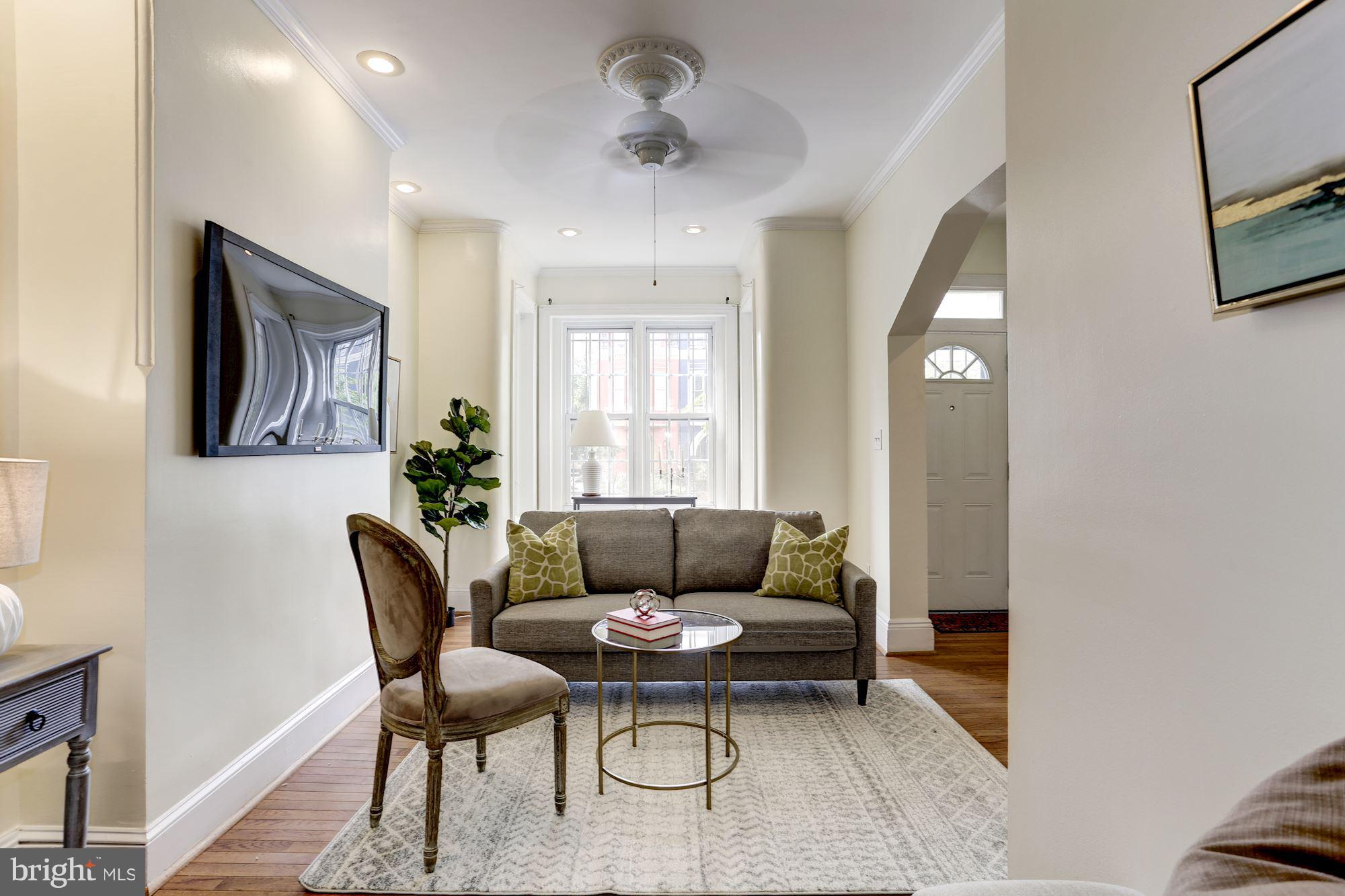727 13th Street Northeast Washington, DC 20002 - Photo 5 of 27 a living room with furniture and a potted plant