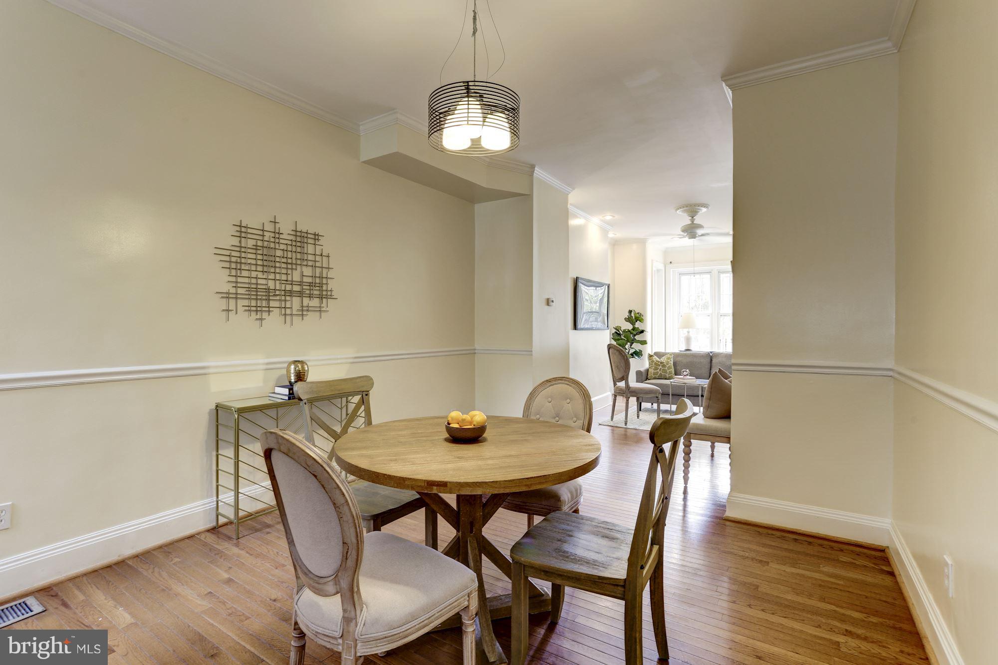 727 13th Street Northeast Washington, DC 20002 - Photo 9 of 27 a view of a dining room with furniture and wooden floor