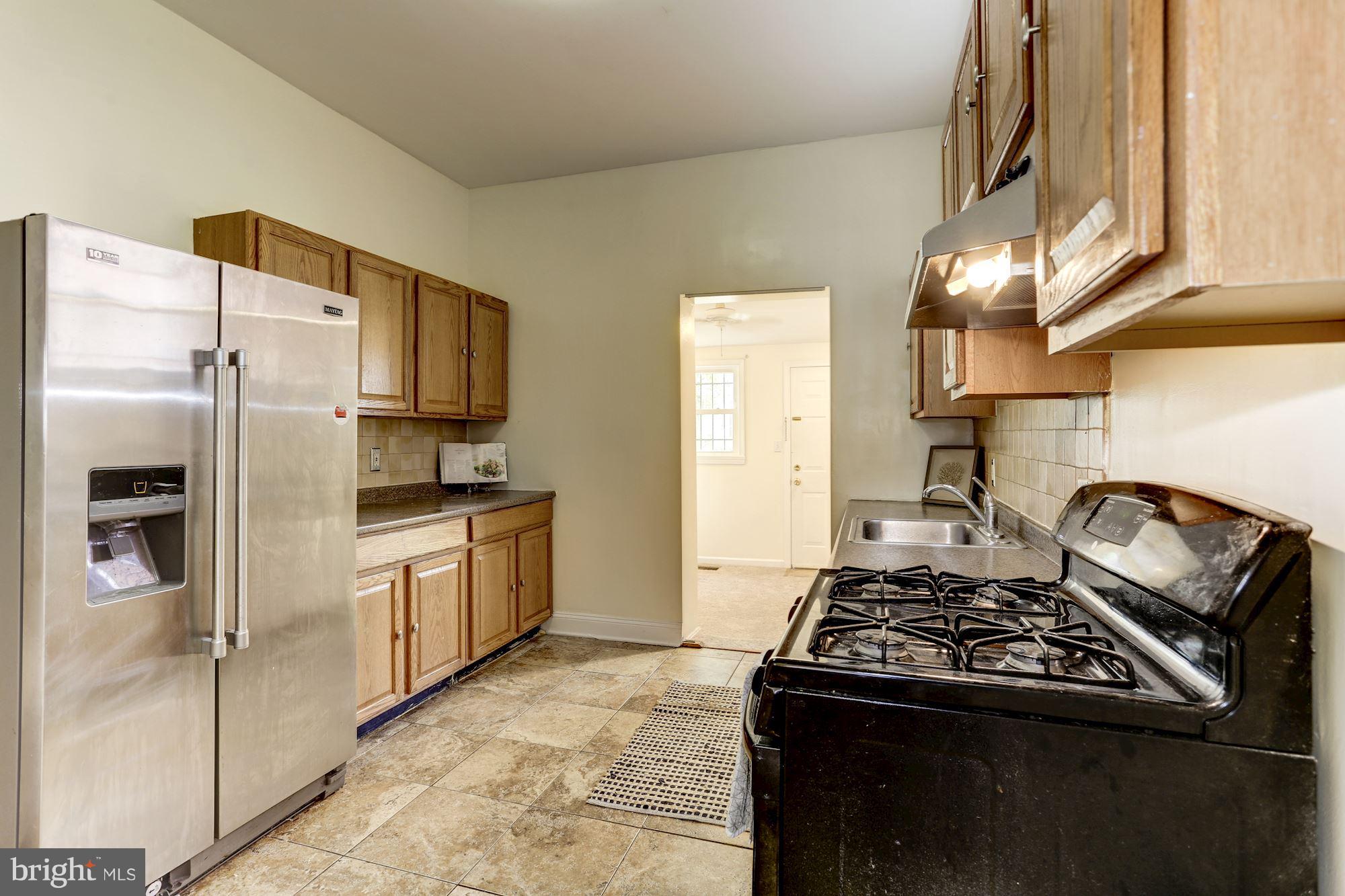 727 13th Street Northeast Washington, DC 20002 - Photo 10 of 27 a kitchen with stainless steel appliances granite countertop a stove a refrigerator and a refrigerator