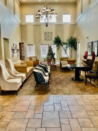 a lobby with furniture and a large window
