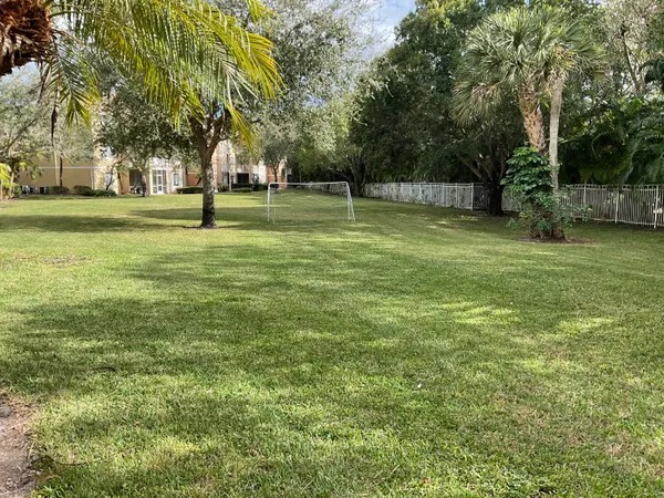 a view of a backyard with sitting area