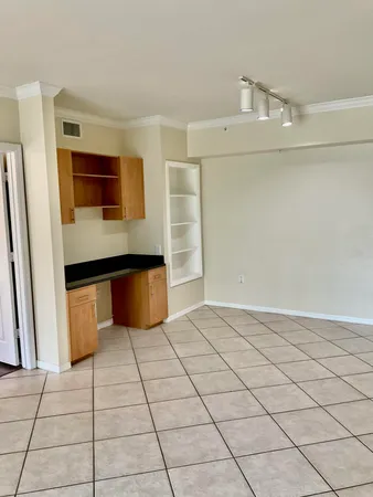 a view of kitchen with stainless steel appliances a sink and a stove top oven
