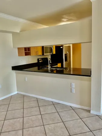 a kitchen with stainless steel appliances a sink and a microwave