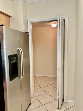 a view of a livingroom with white floor and a window