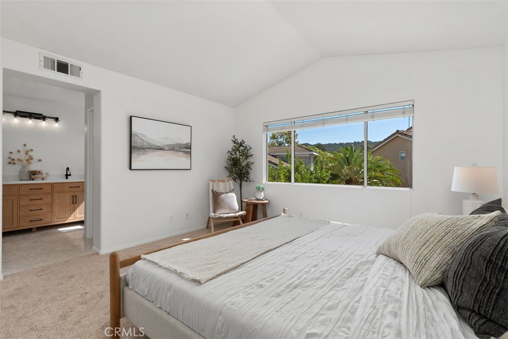 56 Acorn Ridge Rancho Santa Margarita, CA 92688 - Photo 23 of 57 Primary Bedroom: An alternate view highlights the large window, open feel, and direct connection to the ensuite bath.