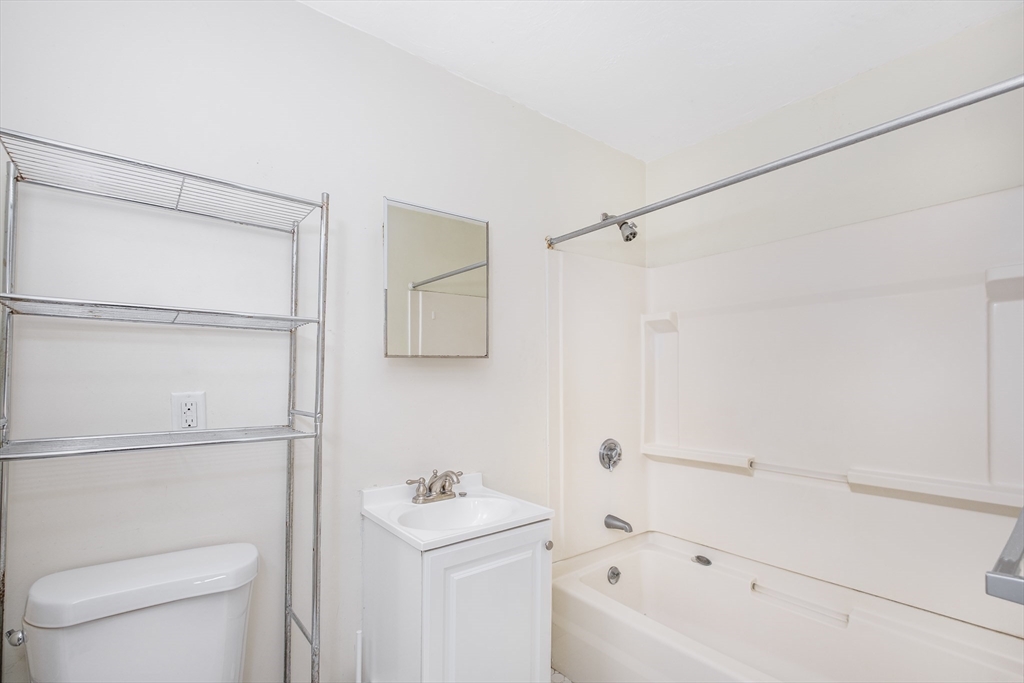 12 Kilby Street, Unit 2R Somerville, MA 02143 - Photo 13 of 19 a bathroom with a toilet a sink and a bathtub