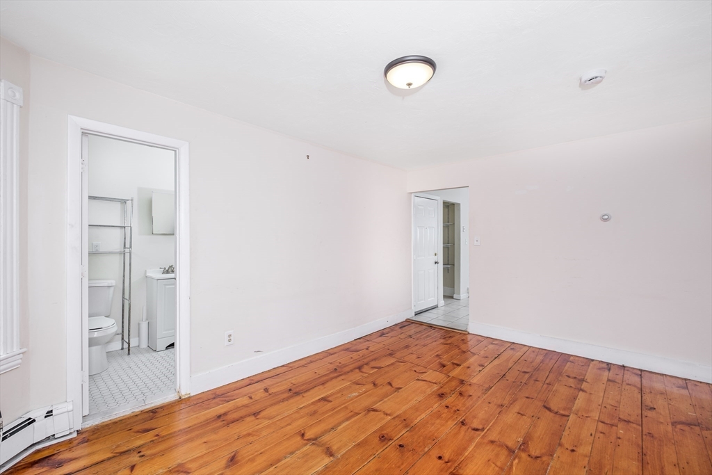 12 Kilby Street, Unit 2R Somerville, MA 02143 - Photo 10 of 19 a view of empty room with wooden floor