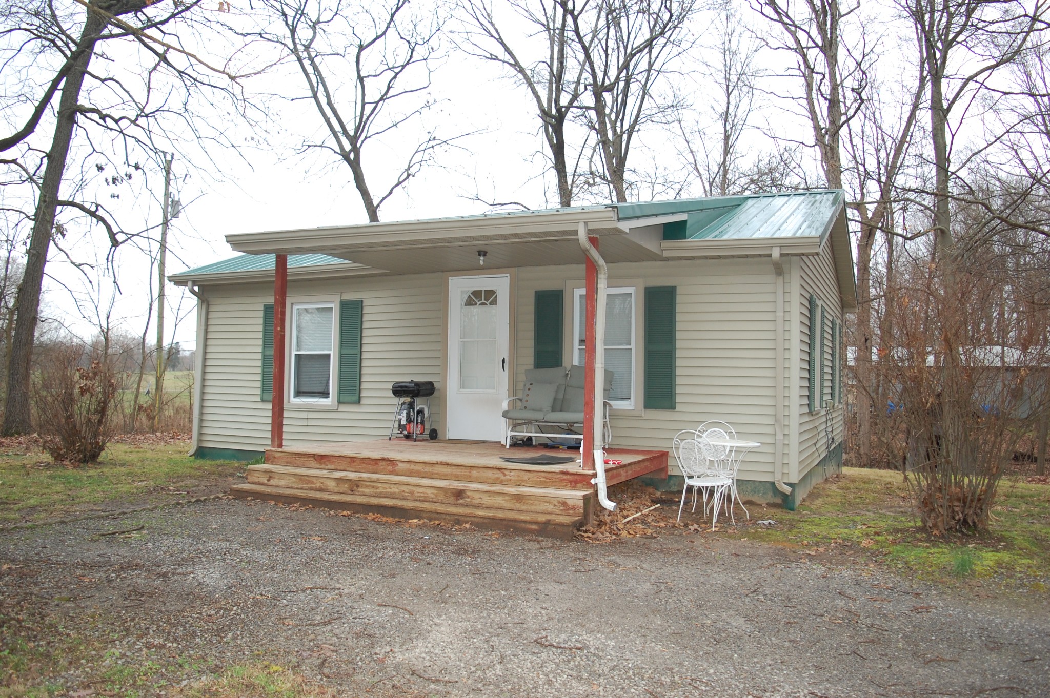 3301 Rossview Road Clarksville, TN 37043 - Photo 1 of 14 a white house that has a tree in front of it
