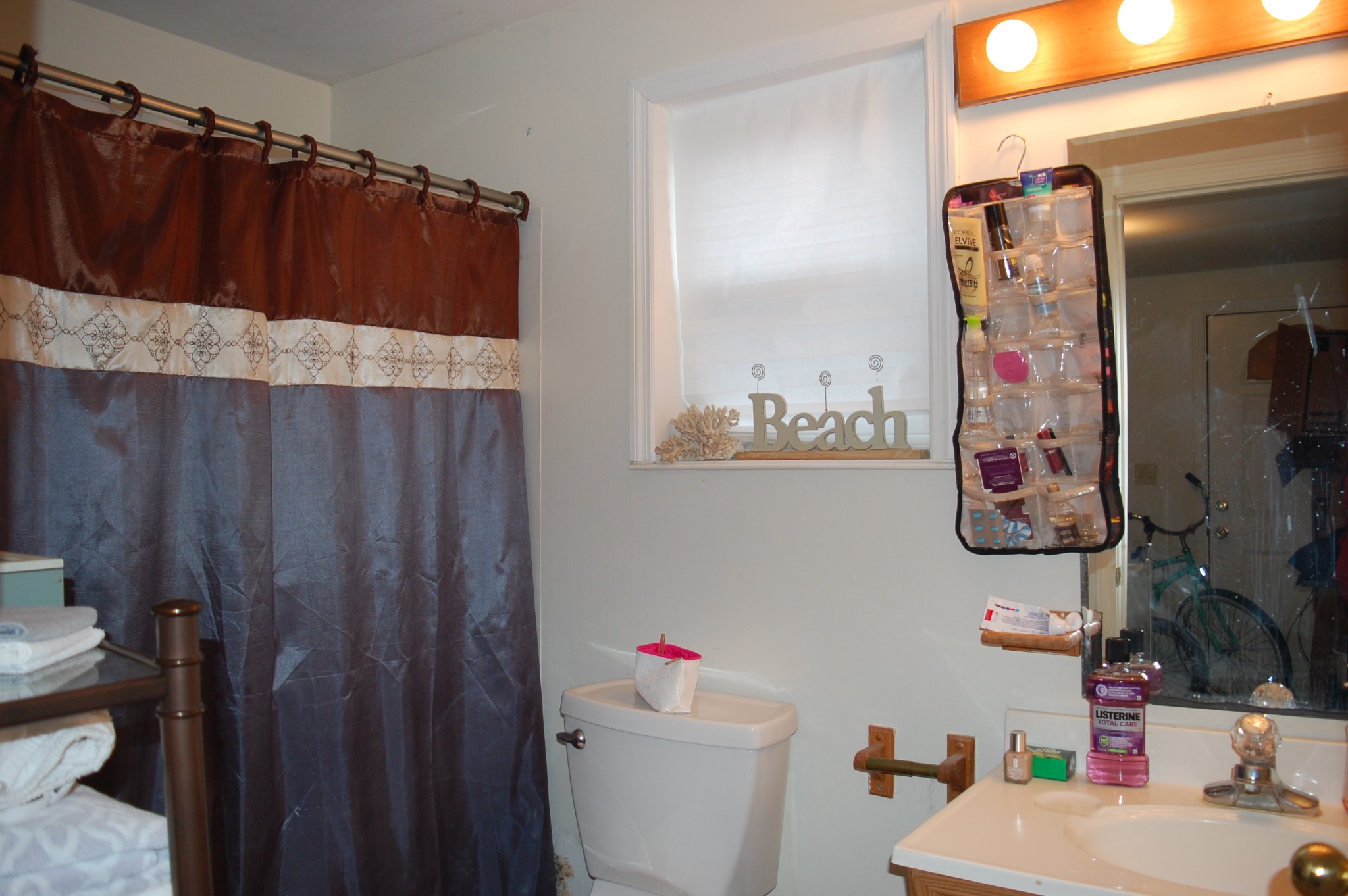 3301 Rossview Road Clarksville, TN 37043 - Photo 7 of 14 a bathroom with a sink and a mirror