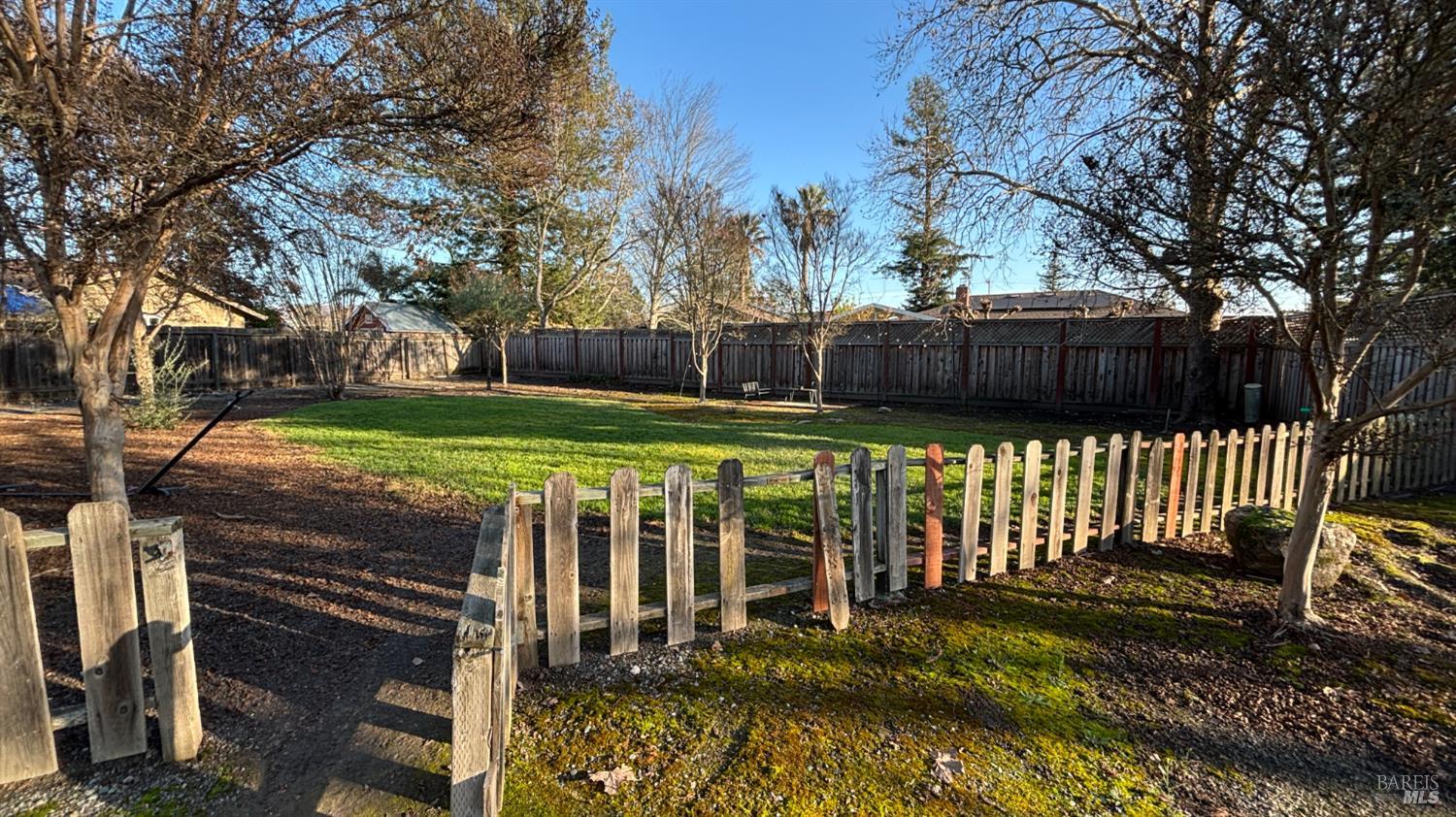 6120 Montecito Boulevard Santa Rosa, CA 95409 - Photo 3 of 17 a view of a wooden deck with a yard