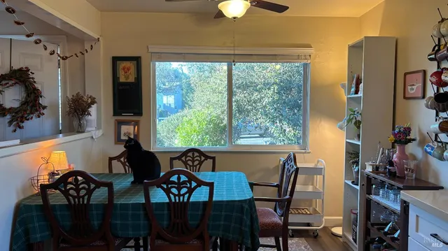 a view of a dining room with furniture window and outside view