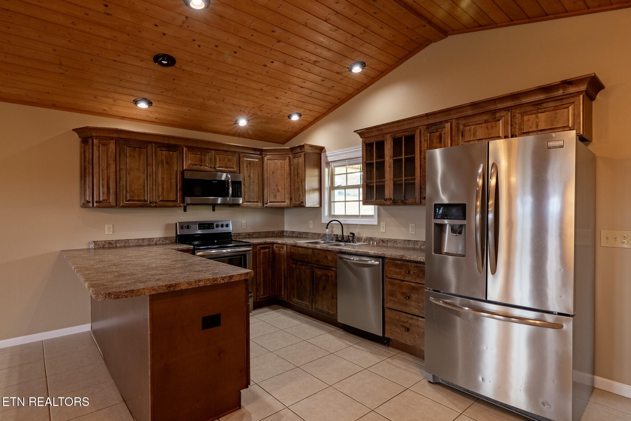 140 Washita Rutledge, TN 37861 - Photo 11 of 38 a kitchen with stainless steel appliances granite countertop a refrigerator stove microwave and sink