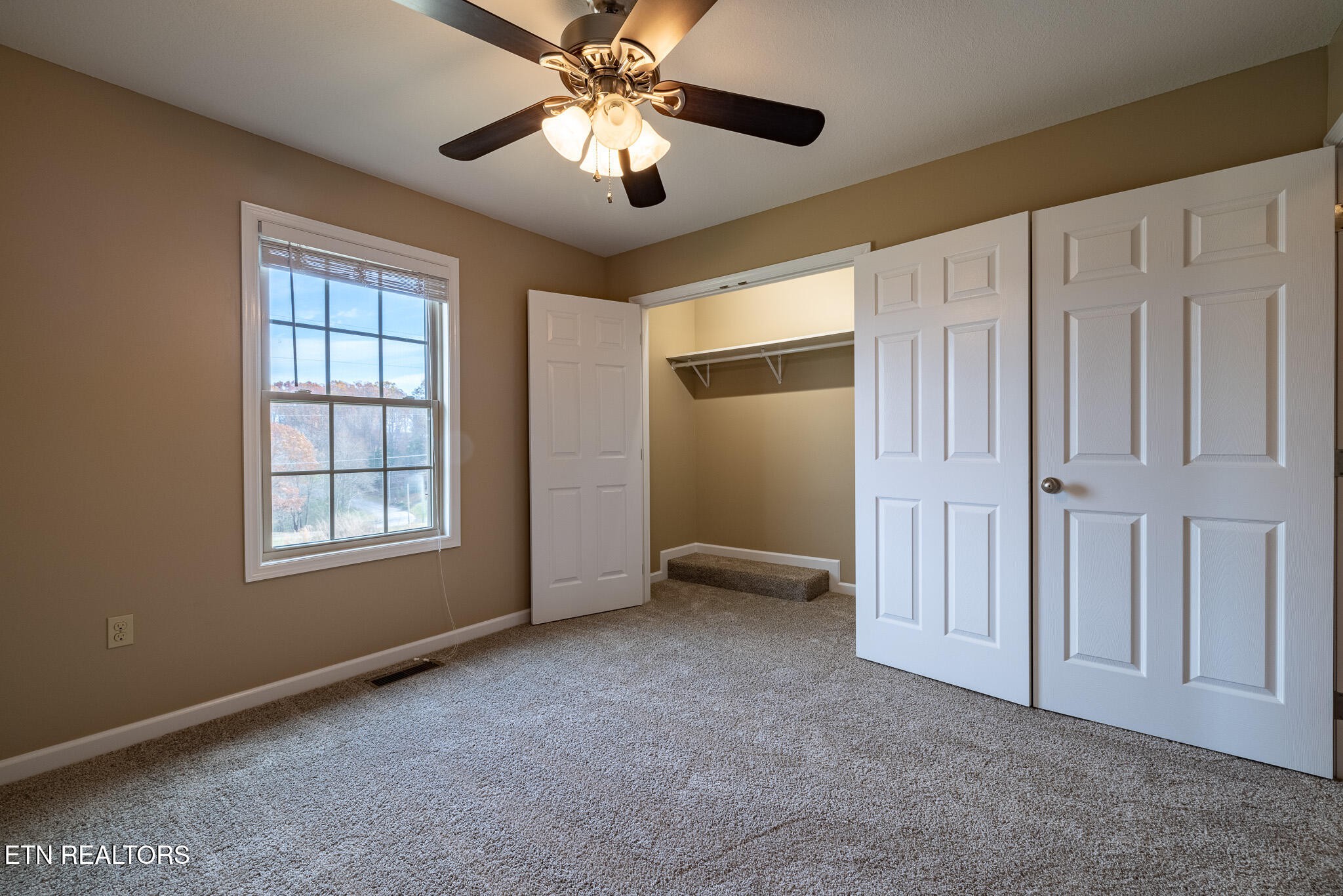 140 Washita Rutledge, TN 37861 - Photo 20 of 38 an empty room with windows and fan