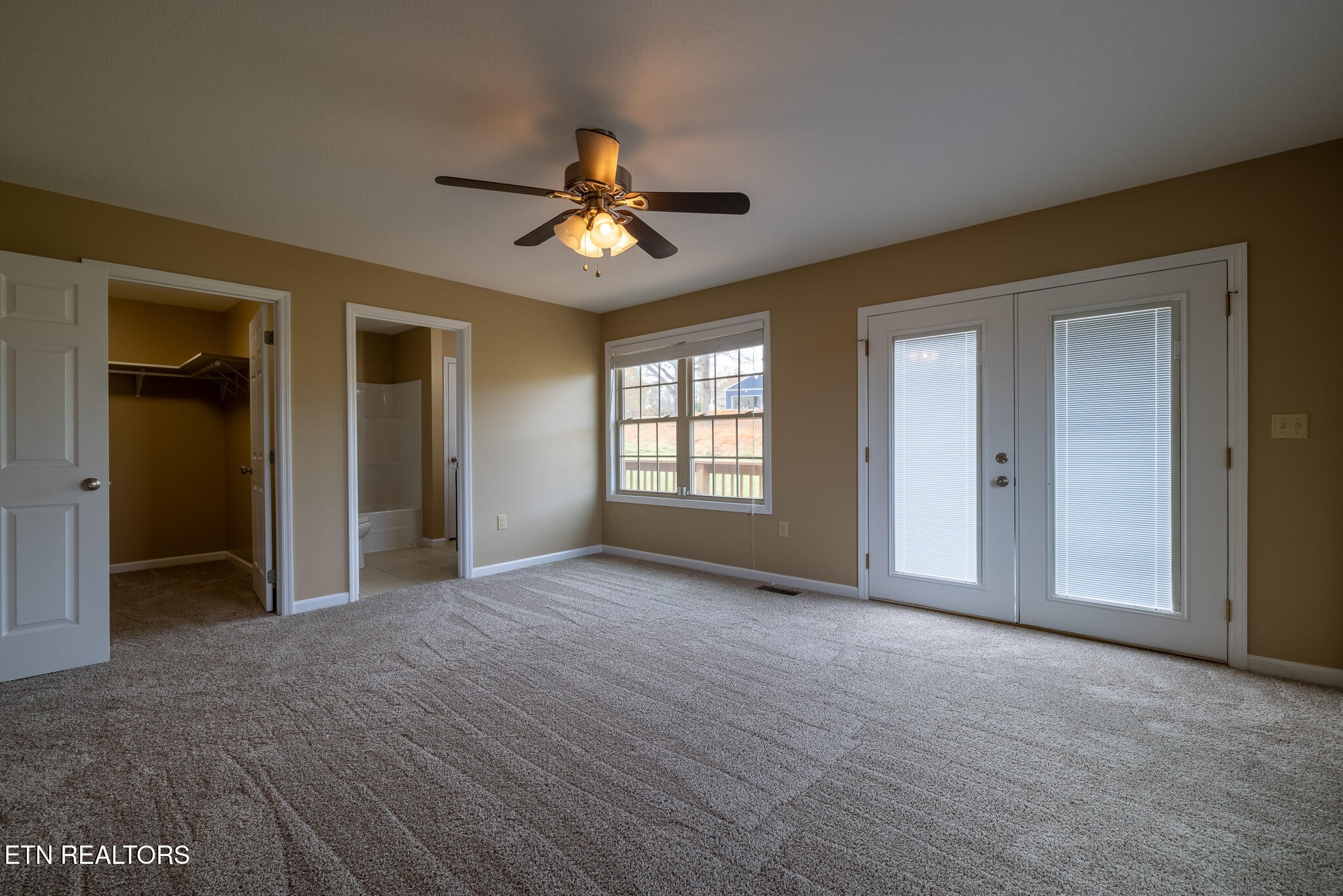 140 Washita Rutledge, TN 37861 - Photo 22 of 38 a view of empty room with windows and ceiling fan