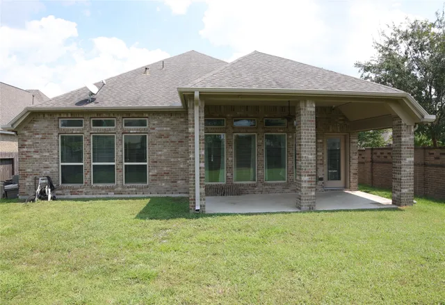 a front view of a house with a yard and porch