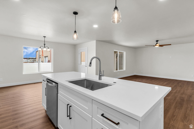576 7th Avenue Midvale, UT 84047 - Photo 32 of 32 Kitchen featuring dark wood finished floors, white cabinetry, ceiling fan, open floor plan, and dishwasher