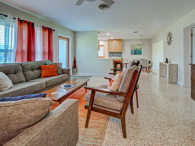 a living room with furniture and a window