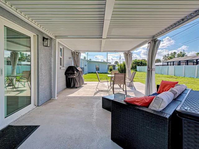 a view of a swimming pool with a patio