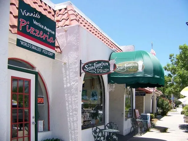 a front view of a building with sign board