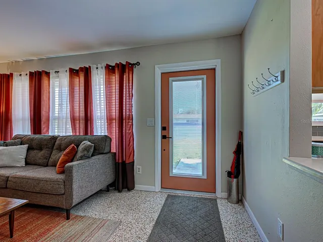 a living room with furniture and a couch