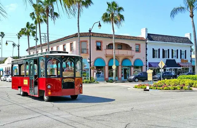 a view of building with cars parked