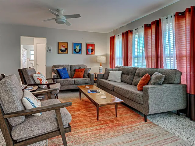 a living room with furniture and a window