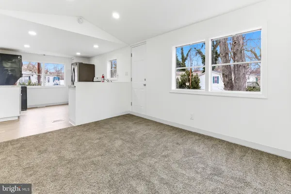a view of a big room with windows
