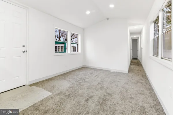 an empty room with windows