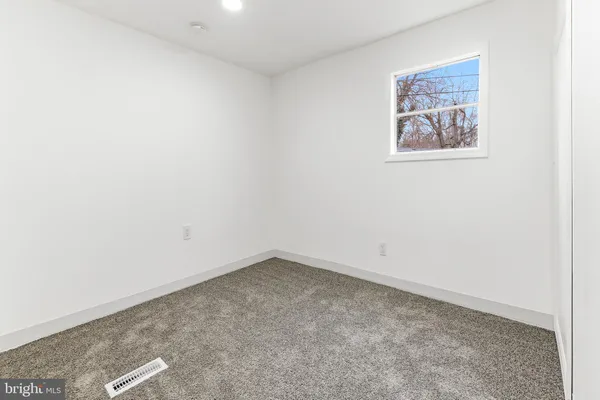 an empty room with a painting