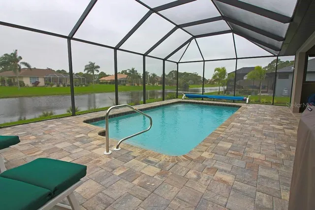 a view of a swimming pool with a porch