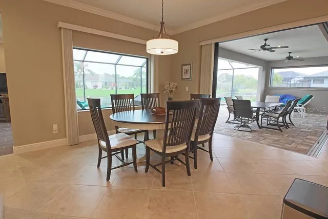 a dining room with furniture window and outside view