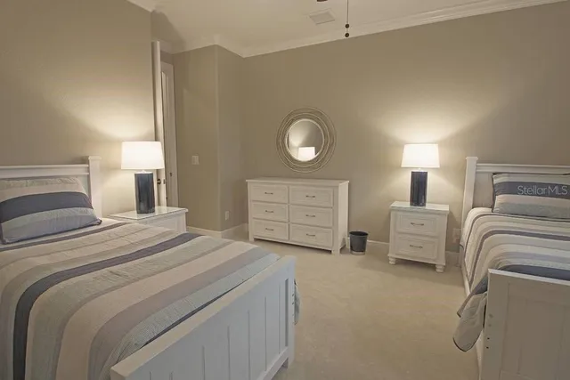 a bedroom with a bed and a lamp