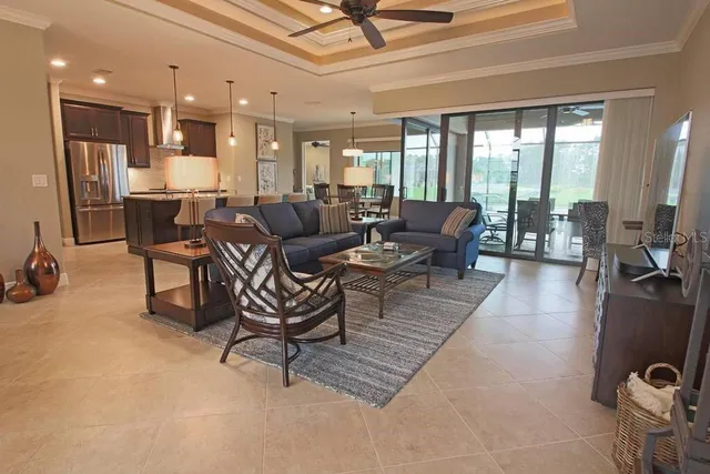 a living room with furniture a large window with outer view