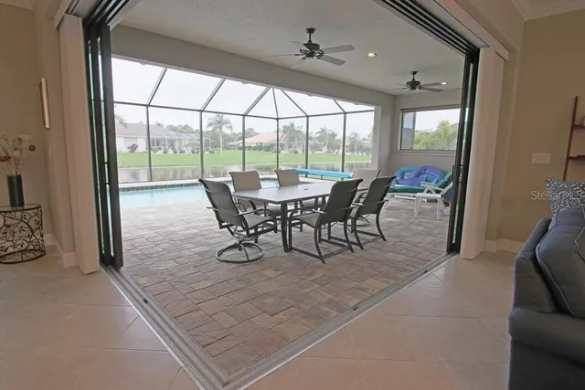 a view of a dining room with furniture window and outside view