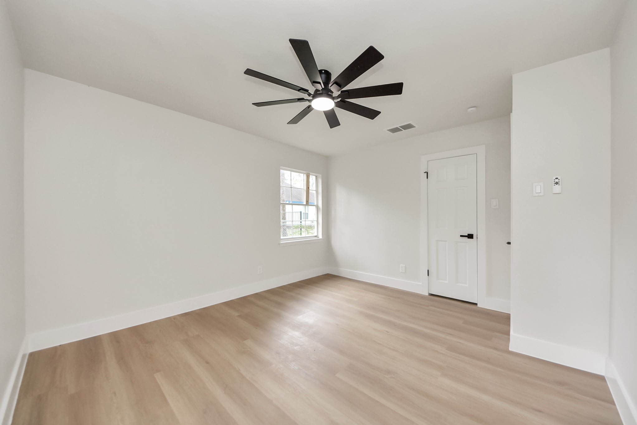 26206 Maplewood Drive Spring, TX 77386 - Photo 32 of 47 a view of a livingroom with a ceiling fan and wooden floor