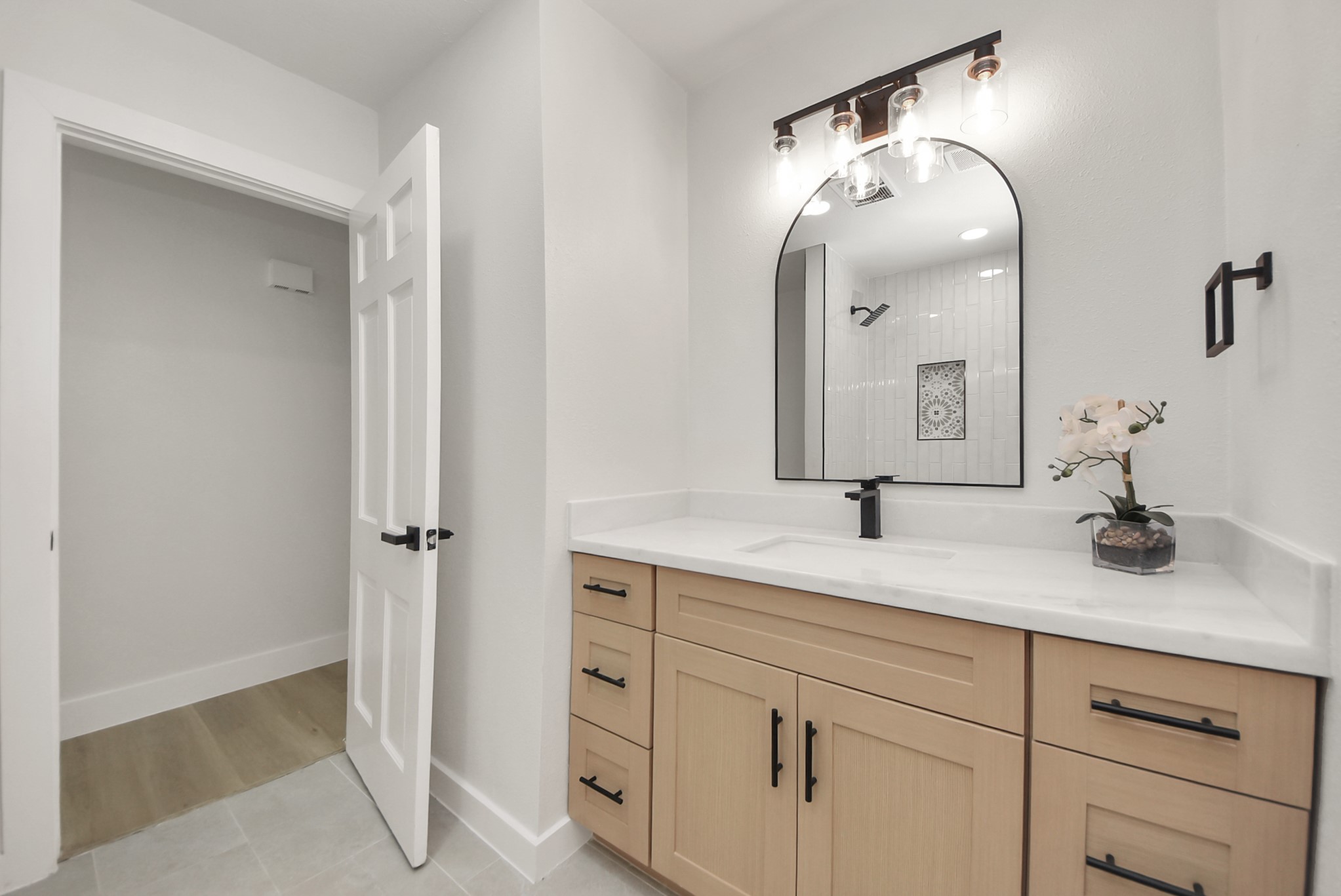 26206 Maplewood Drive Spring, TX 77386 - Photo 33 of 47 a bathroom with a double vanity sink and mirror