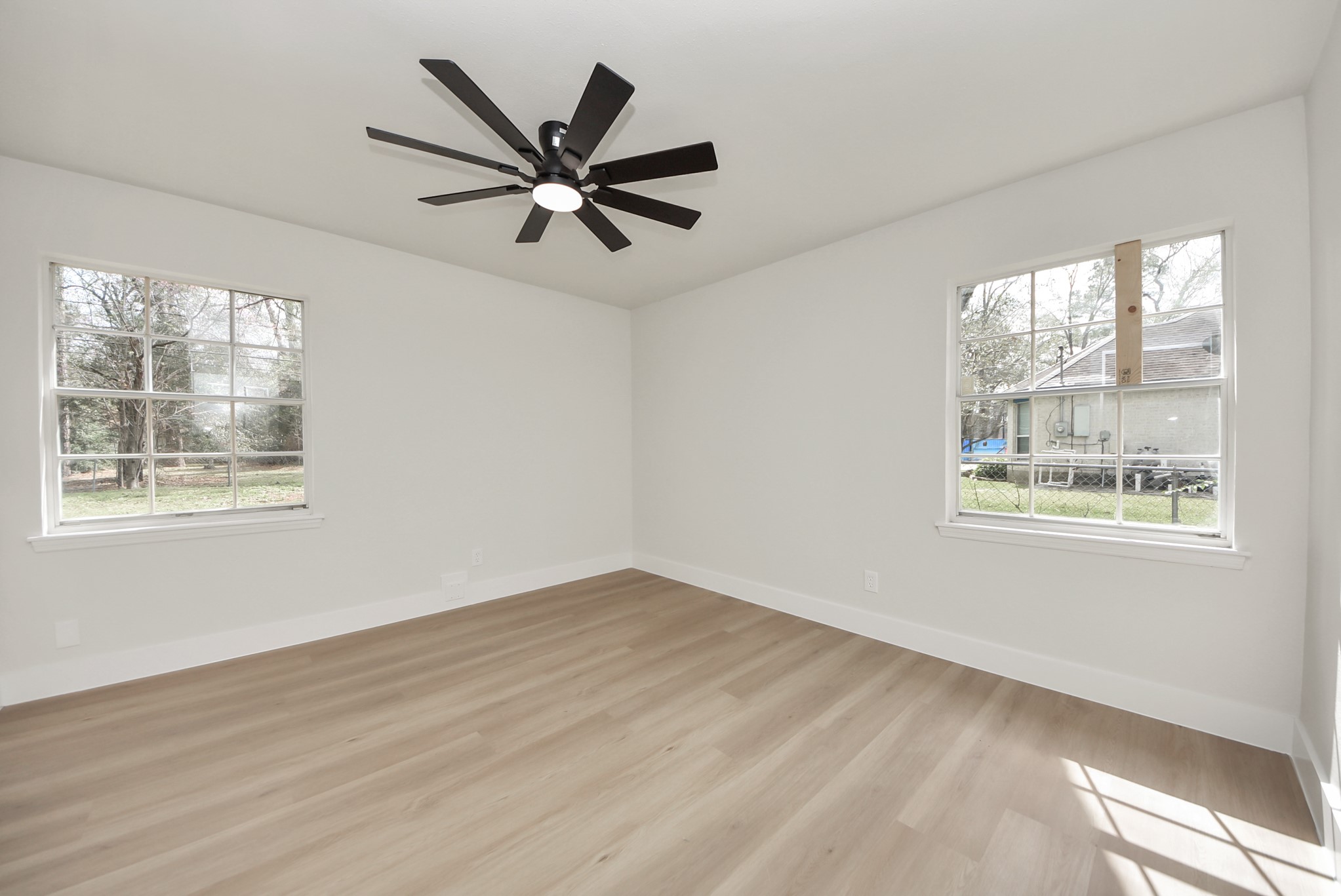 26206 Maplewood Drive Spring, TX 77386 - Photo 35 of 47 a view of a big room with wooden floor and windows