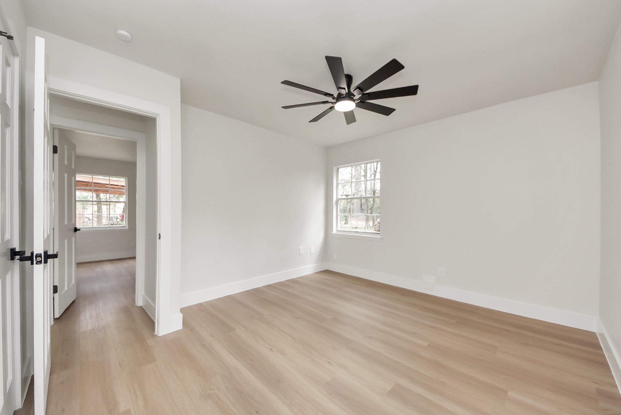 26206 Maplewood Drive Spring, TX 77386 - Photo 36 of 47 a view of empty room with wooden floor and fan