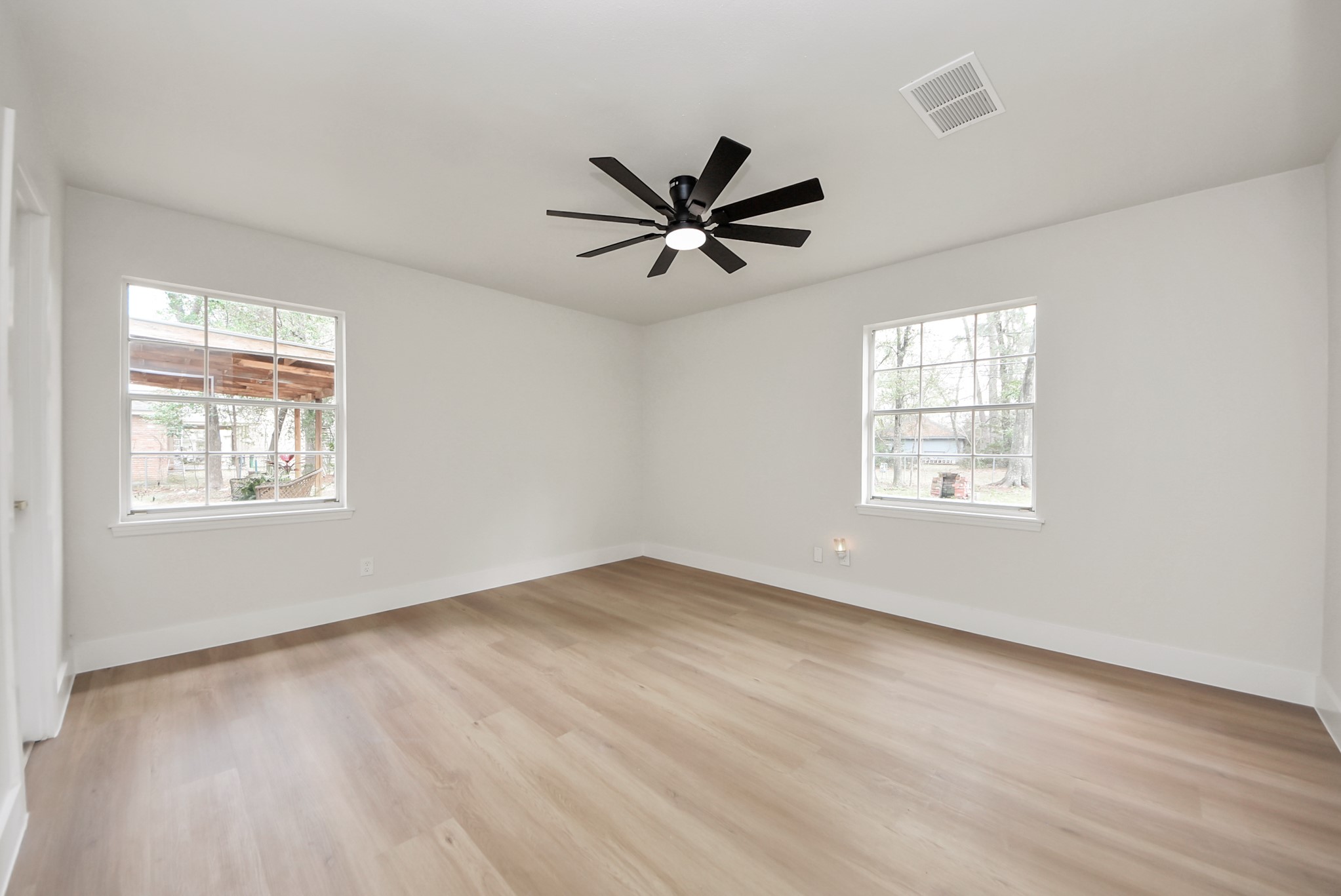26206 Maplewood Drive Spring, TX 77386 - Photo 37 of 47 wooden floor in an empty room with a window