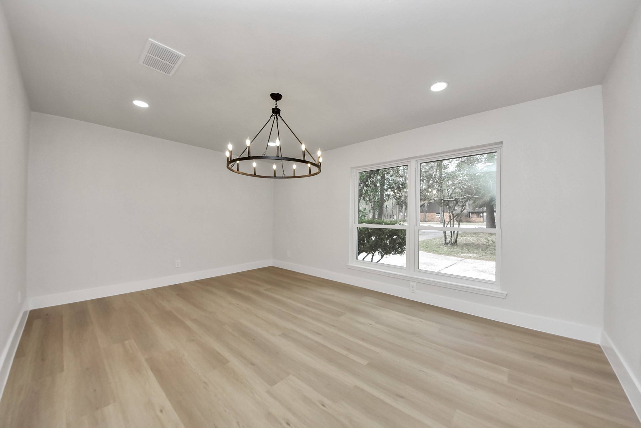 26206 Maplewood Drive Spring, TX 77386 - Photo 8 of 47 a view of room with window and wooden floor