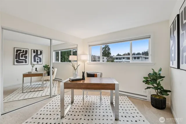 a living room with furniture and flowers