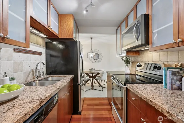 a kitchen with granite countertop lots of counter top space