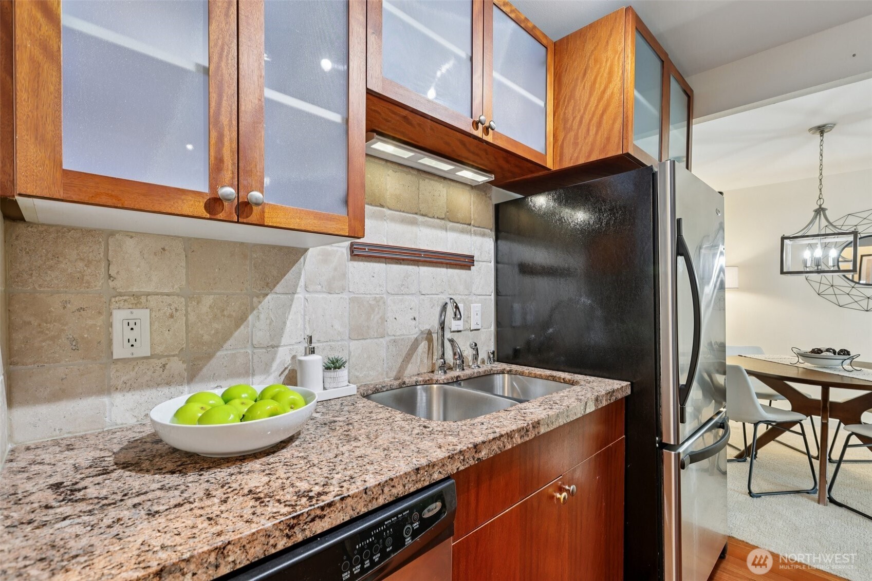 960 5th Avenue South, Unit 208 Edmonds, WA 98020 - Photo 5 of 26 a kitchen with a sink a stove and cabinets